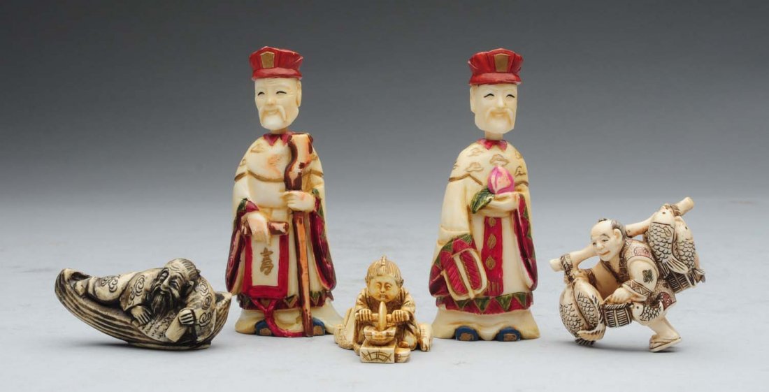 Lot of 5: Netsukes and other Figures.: This lot contains three Netsukes. They include a reclining man, a fisherman, and a boy working a wheel. Also included are two figure containers with removable heads. A nice group. Condition (Very Good