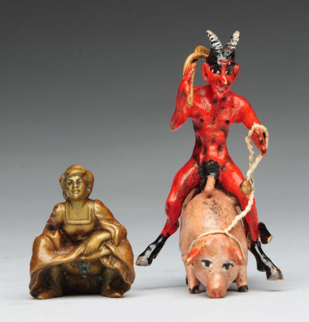 Erotic Vienna Cold Painted Bronze Figure.: Depicts a devil riding a pig signed Bergman. Also a small Vienna bronze lady perfume sprayer which is missing the rubber squeeze ball. Condition (Good). Size Largest" 2" T.