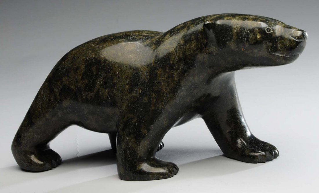 Carved Serpentine Bear by Joe Parr: This awesome bear was carved by Inuit artist Joe Parr. He is in great condition with no chips or cracks. This bear still retains the Eskimo Art Esquimau sticker on one foot. Condition (Excellent). Siz