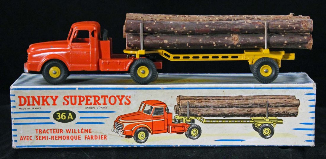 Dinky SuperToys Tractor Willéme Log Truck.: No. 36A in box, circa 1956, Meccano, France. Orange cab; complete with seven logs. A couple of small scattered chips and paint rubs where the trailer contacts. It is still very nice. Condition (C8 Exc