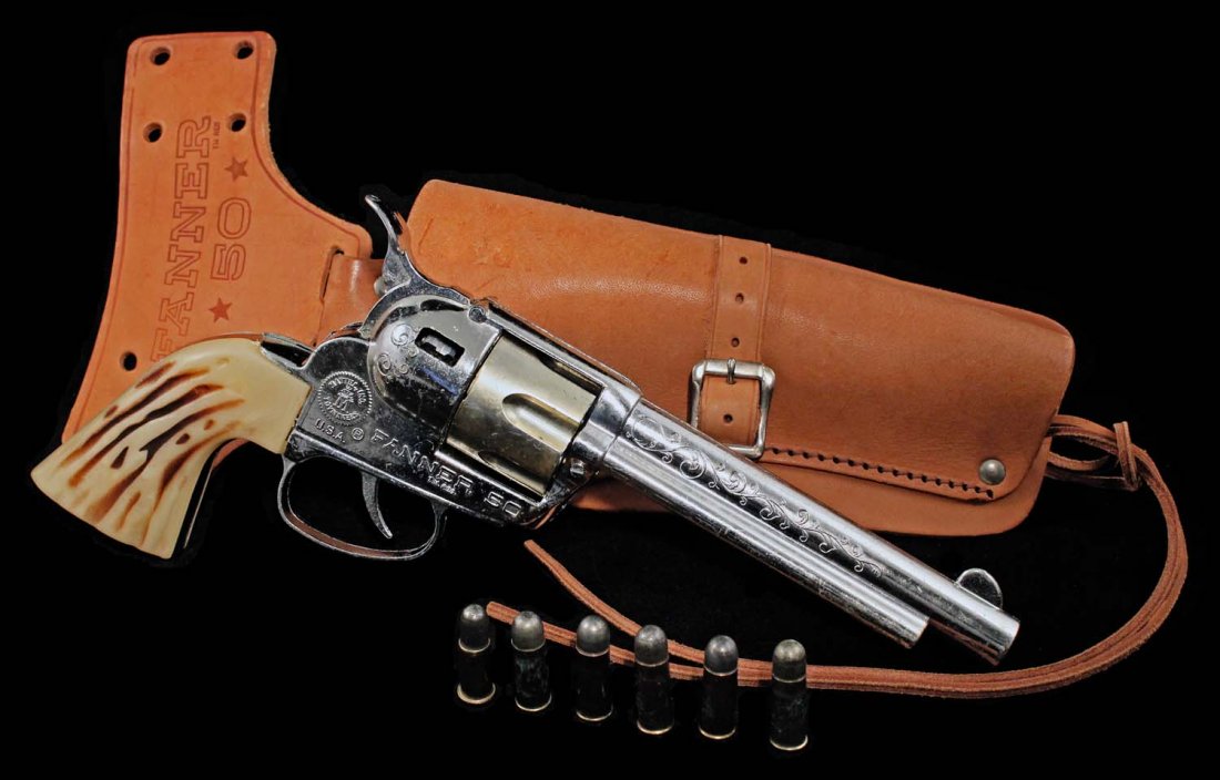 Mattel Fanner 50 Smoking Cap Pistol in Holster.: Circa 1958. Diecast with plastic grips and six metal bullets in genuine cowhide holster. Gun has light surface scuffs, and cylinder is slightly discolored. Unfired. Condition (C8 Excellent - C9 Near M