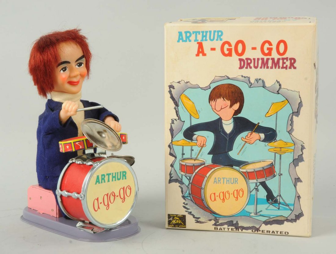 Arthur A-Go-Go Drummer.: Made by Alps Japan. Includes colorful original box. It is a Beatles knock-off of Ringo Starr, showing mop-top type hair. The drum head is original, and the box has some creasing and minor staining. Co