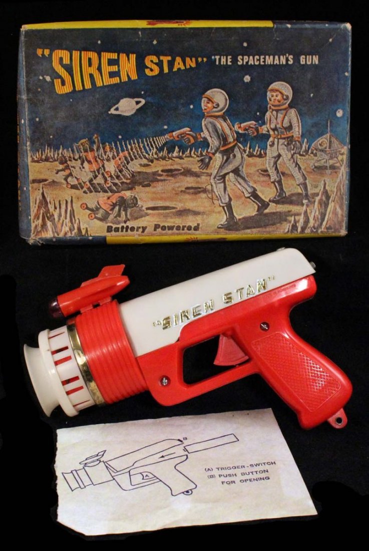 Siren Stan the Spaceman's Gun.: In box, circa 1960s. Plastic battery-operated gun with some chips and minor cracks on tip. Includes instruction sheet. Box has one corner split. Condition (C7 Very Good - C8 Excellent). Size 8" L.