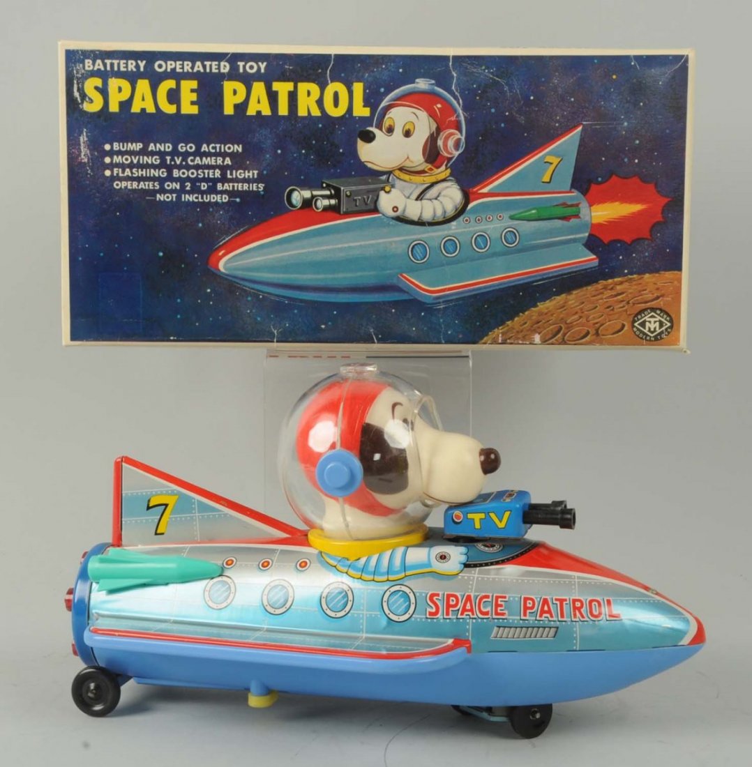 Japanese Battery-Operated Tin Litho Space Patrol.: The toy includes its original box with inserts, and is made by Modern Toys. There is colorful lithography to the top of the box and depicts a dog riding in the space patrol vehicle. The pilot resemble