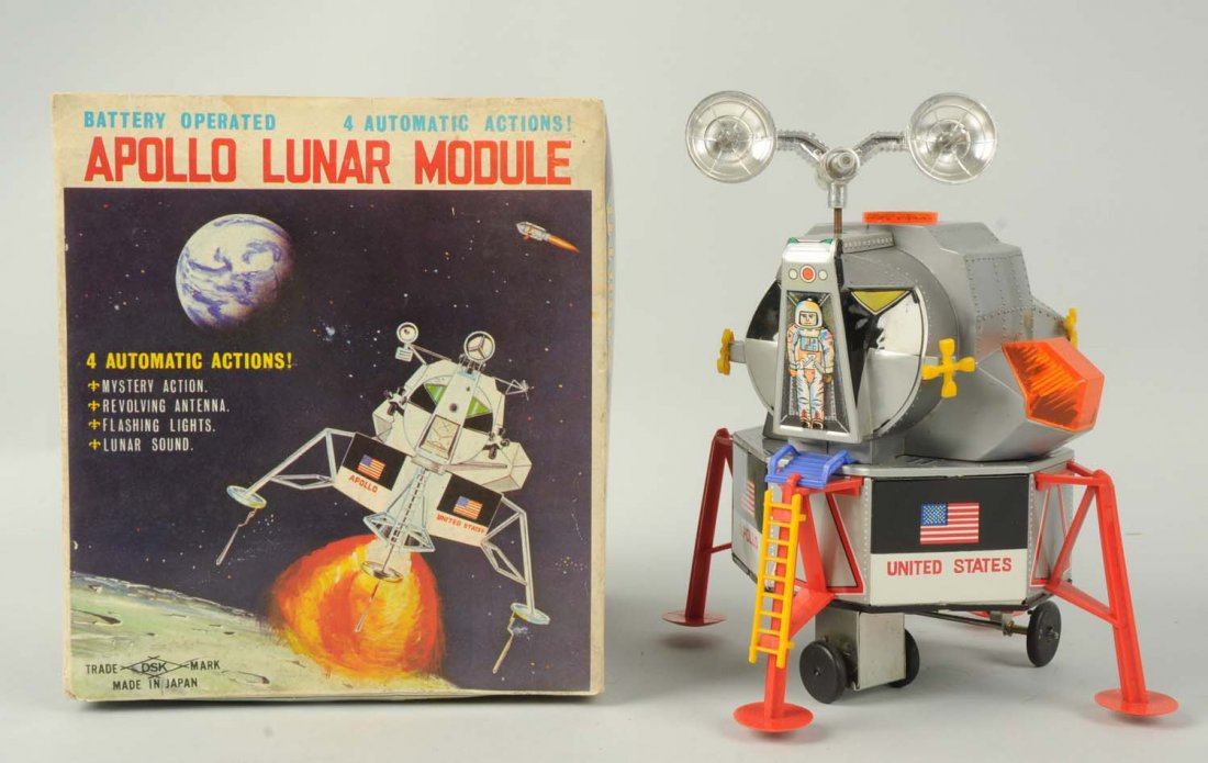 Japanese Battery-Operated Apollo Lunar Module.: The toy includes its original box, which is marked "DSK Made In Japan". The toy is a combination of tin and plastic with the original antenna. It is marked "United States" with the American flag. Ther