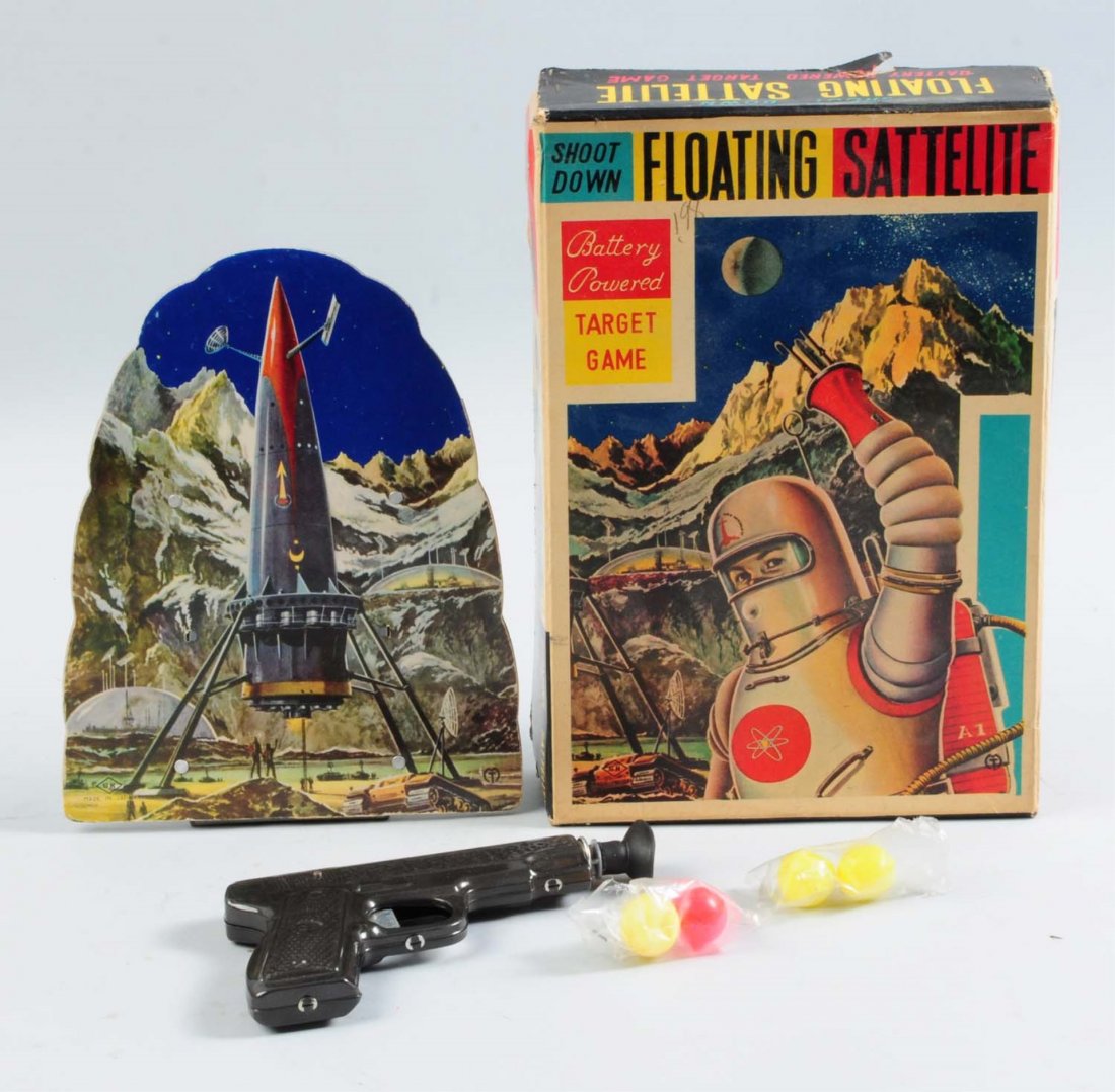 .Satellite Space Target Game.: Japanese battery-operated floating satellite space target game. Include original tin litho gun and dart. Four original cellulite balls, three are slightly dented. Original box insert. Target is made b