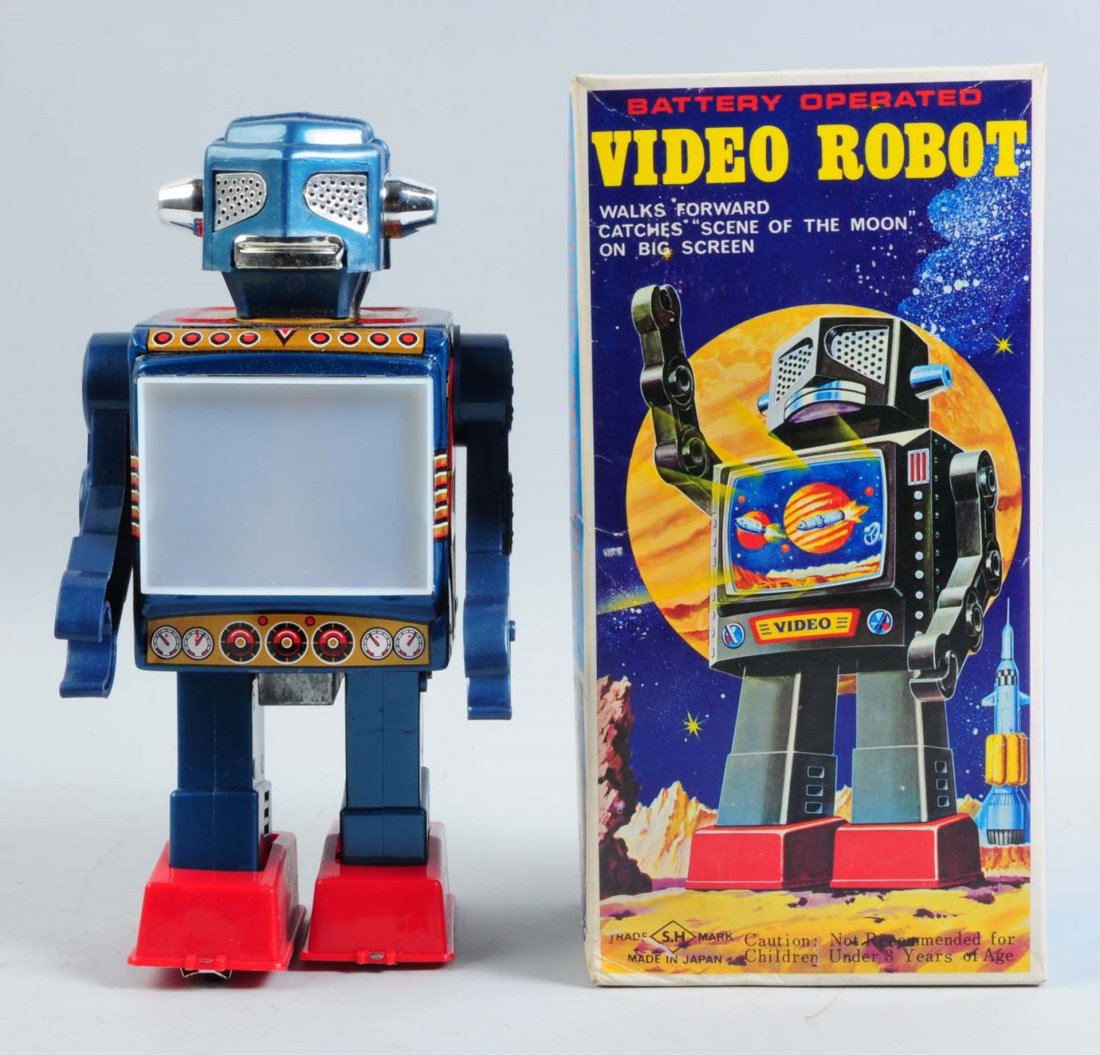 Japanese Battery-Operated Video Robot.: Includes colorful original box with image of robot on the front. Made by S.H. Japan. The robot is made of a combination of tin and plastic. When in operation the TV screen lights up and shows space sc