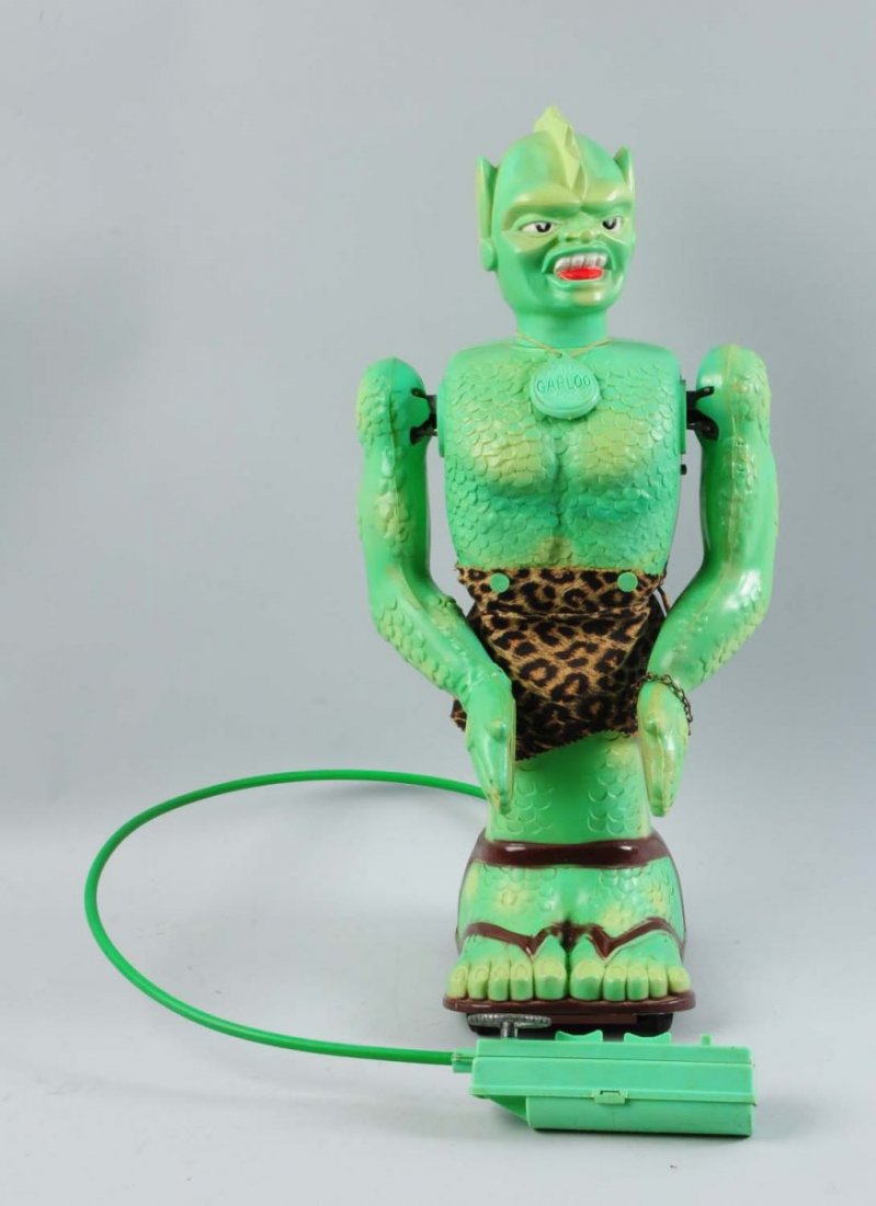 Battery-Operated Remote Control Garloo Marx Toy.: The toy is missing front pads is not working properly, and needs some cleaning. Otherwise, the battery cover is present and it has original clothing. Condition (Very Good). Size 22" T.