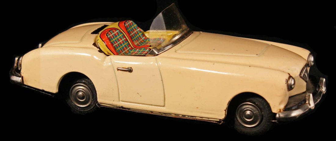 1954 Kaiser Darren Convertible Coupe.: Circa 1950s, Ichiko, Japan. Beige tin friction with detailed litho interior, missing hard top, otherwise excellent. Condition (C8 Excellent). Size 8" L.