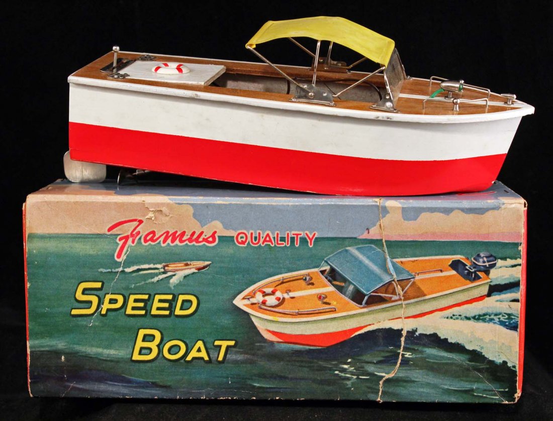 Japanese Famous Quality Speed Boat in Box.: Circa 1950s. Painted wood battery operated with metal fittings and vinyl top, and inboard engine. Mint in colorful box with inserts. Inside tape repairs. Condition (C7.5 Very Good). Size 9" L.