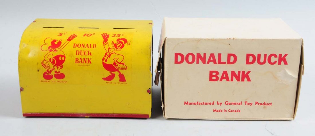 Donald Duck Bank.: Walt Disney tin Donald Duck bank. Original box and original trap. Box marked Donald Duck bank manufactured by general toy product. Made in Canada. Nice depictions of Donald Duck and Mickey Mouse on a 