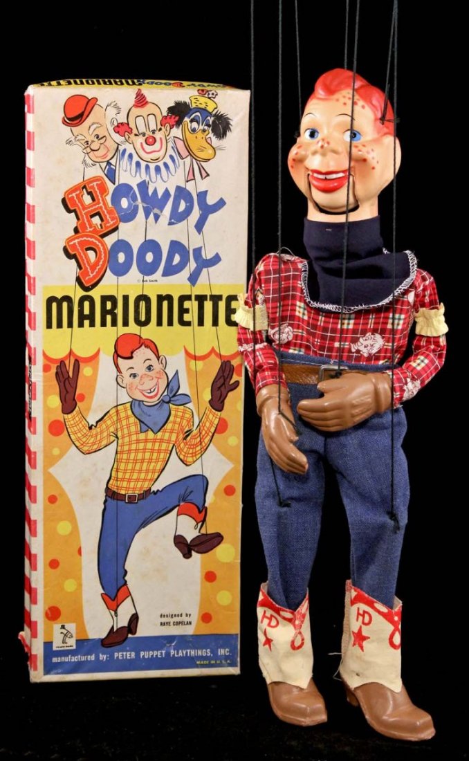 Howdy Doody Marionette.: In box. Circa 1952. Peter Puppet Playthings. Composition head, hands and feet. Cloth outfit on wooden body. Minor paint loss to his nose. Among the cleanest Howdy marionettes we've come across. Condit