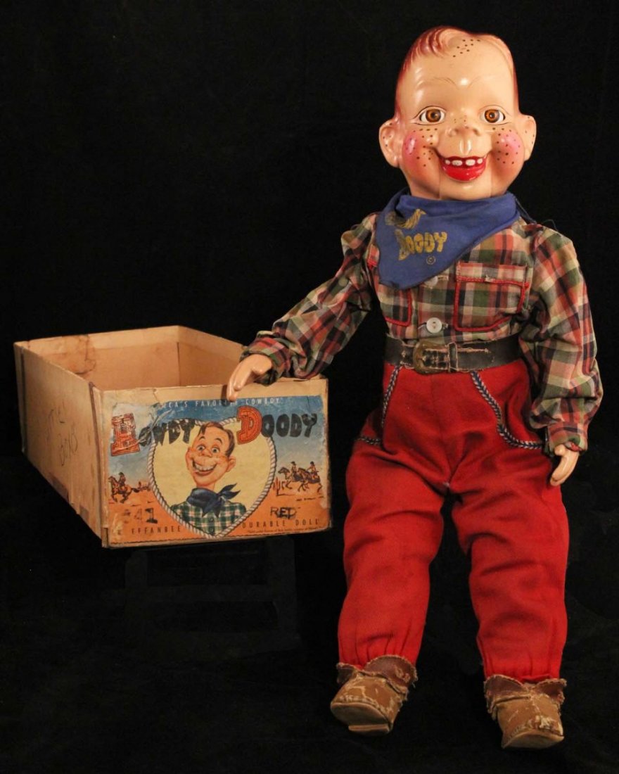 Howdy Doody Doll.: In partial box. Circa 1949. Effanbee No. 641. Stuffed cloth body with composition head and hands, sleeping gold eyes. Some paint crazing with minor paint loss to hair, and composition chipped behind b