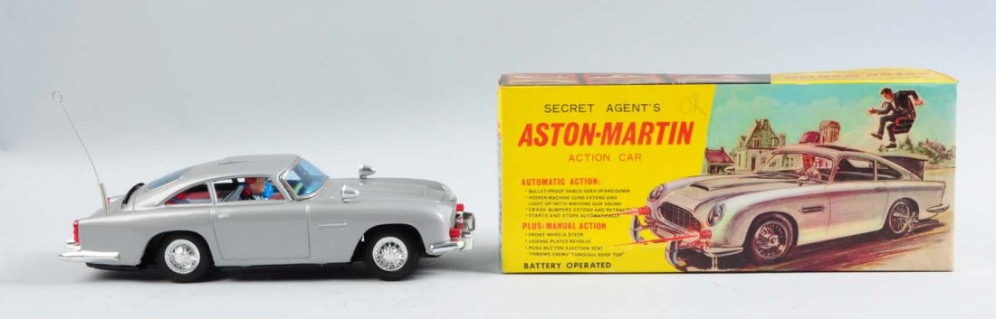 Japanese Battery Operated Aston Martin Car.: Japanese battery operated secret agent Aston-Martin toy car. Includes original box showing Sean Connery in front and a man being ejected. This is the James Bond car in which the box was changed to a s