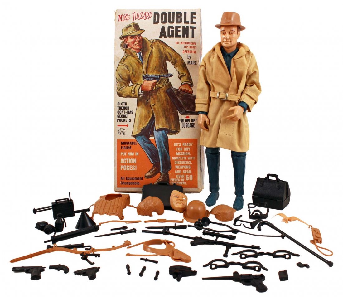 Mike Hazard, Double Agent Figure.: In box, circa 1960s, Marx. This classic spy toy comes with his cloth 'secret pocket’ trench coat, exploding briefcase, weapons, disguises, and much more; no instruction sheet, otherwise appears comp