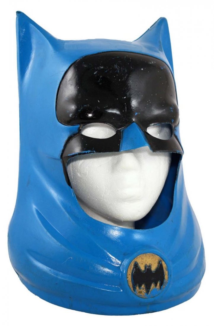Batman Helmet.: Circa 1966, Ideal. Molded painted vinyl cowl; no cracks, but lots of surface scuffs and minor paint loss. Condition (C7 Good). Size 12" L.
