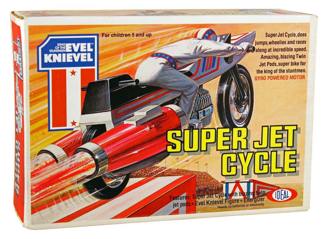 Evil Knievel Super Jet Cycle.: In factory sealed box, circa 1976, Ideal. The box has only the slightest corner dent at bottom left; crisp and clean with strong colors, still factory sealed; none better. Condition (C9.5 Near Mint Pl