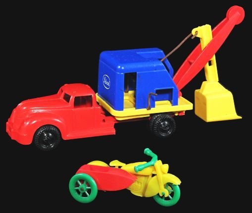 Lot of 2: Motorcycle with Sidecar & Shovel Truck.: Circa 1950s. Motorcycle with side car, Renwal. Three colors, has “20¢” Woolworth’s price tag under sidecar; steam shovel truck, Ideal. Four colors, working bucket. Condition (C8.5 Excellent Plu
