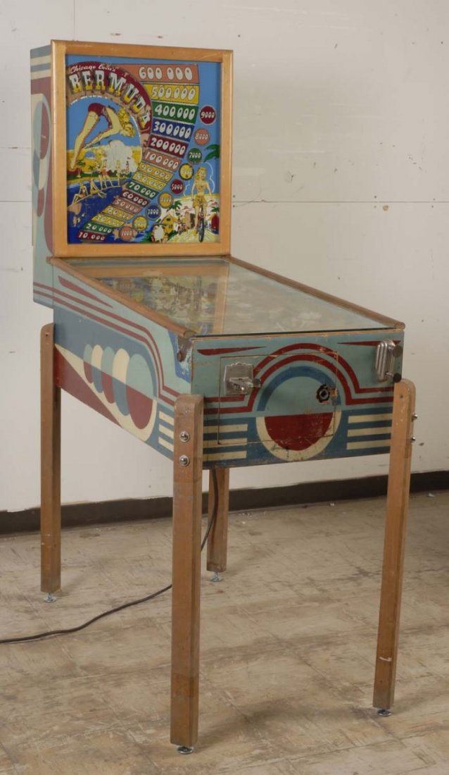 1947 Chicago Coin Bermuda Pinball Machine.: The playfield is very good with arch wear and sunken inserts. The backglass is fair with heavy flaking and peeling. The cabinet is good and original, it has scratches, door damage, and the front moldi
