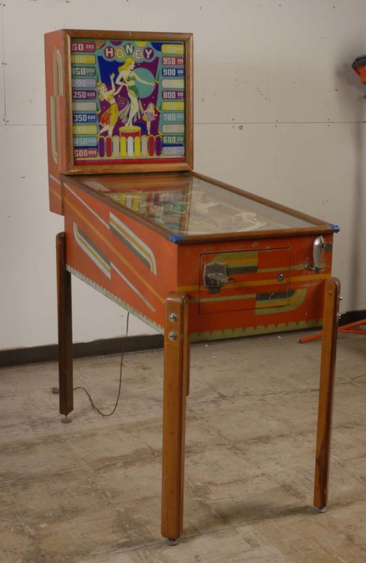 1947 Genco Honey Pinball Machine.: The playfield is fair with some wear spots, touch-ups, and missing caps. The back glass is fair with some flaking. The cabinet is good and original with some scrapes. The machine will not power up. Pl