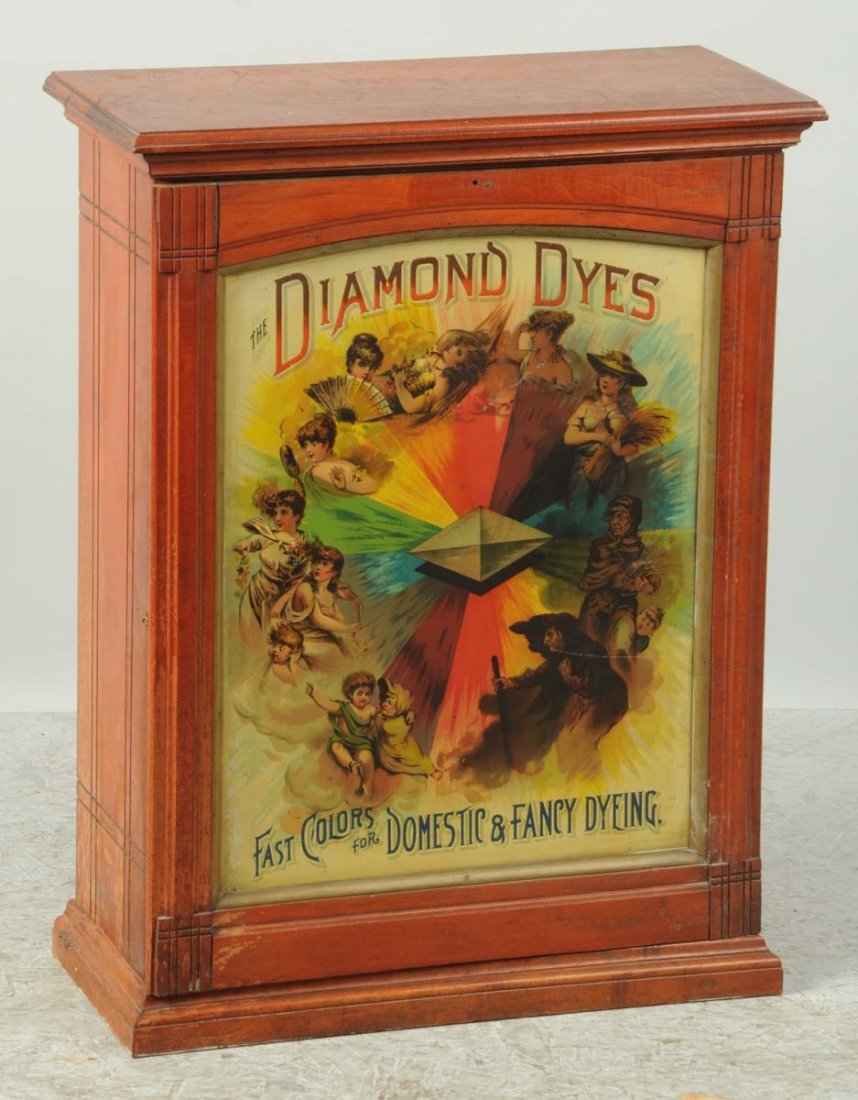 Diamond Dyes Cabinet.: The front panel has two small scratches and there are a few scrapes to the wooden areas. The interior partitions are present. Condition (Very Good). Size 29 - 1/2" T.