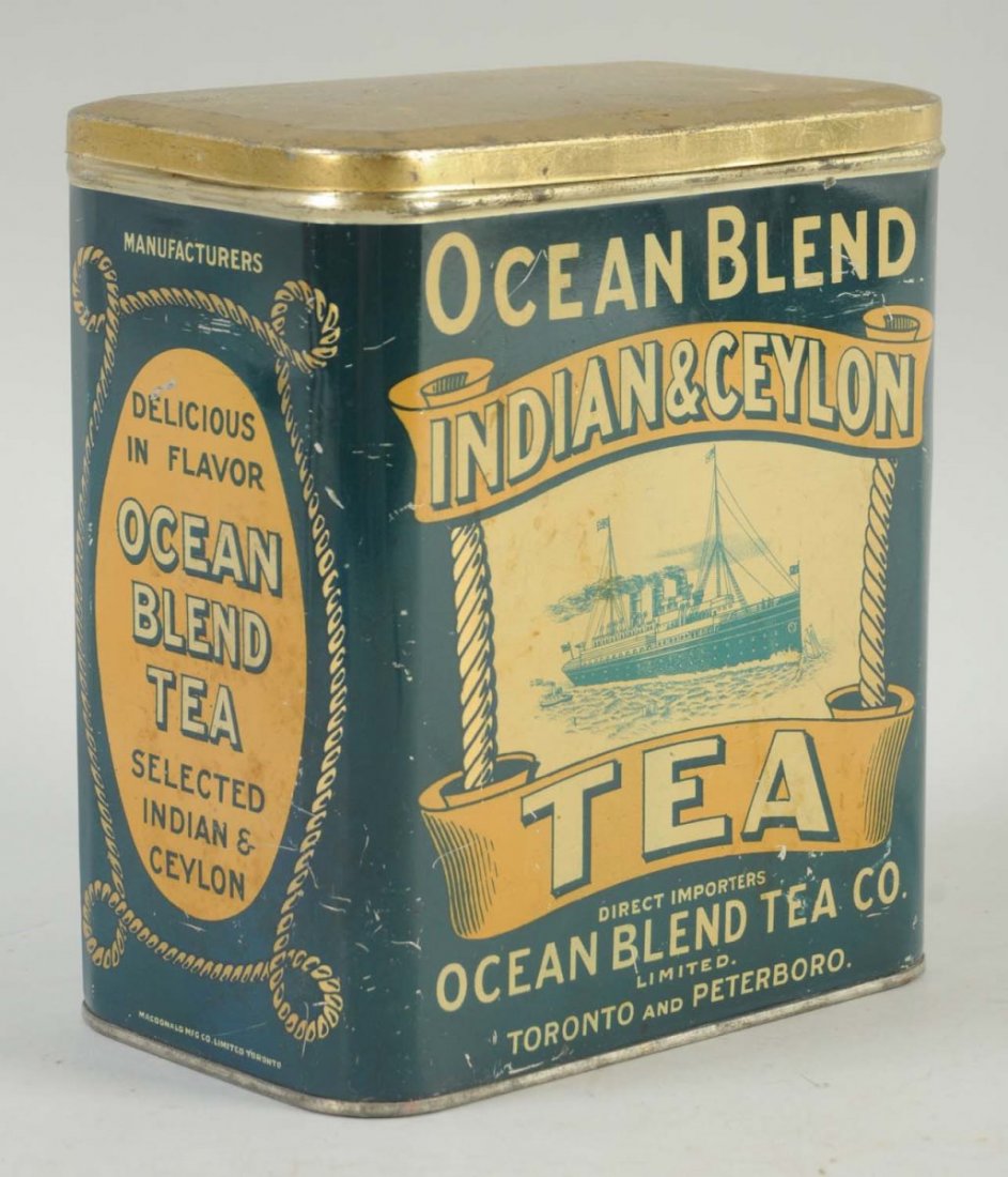 Ocean Blend Tea Tin.: Nicely detailed with an ocean liner on both the front and back. Good color with minimal wear. Condition (Excellent). Size 7" L.