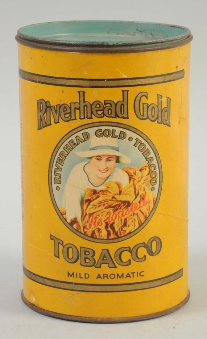River Head Gold Tobacco Tin.: Cardboard body with tin top and bottom. Nice piece that is not often available. Good overall color and detail. Minimal amounts of wear. Condition (Excellent). Size 7" L.