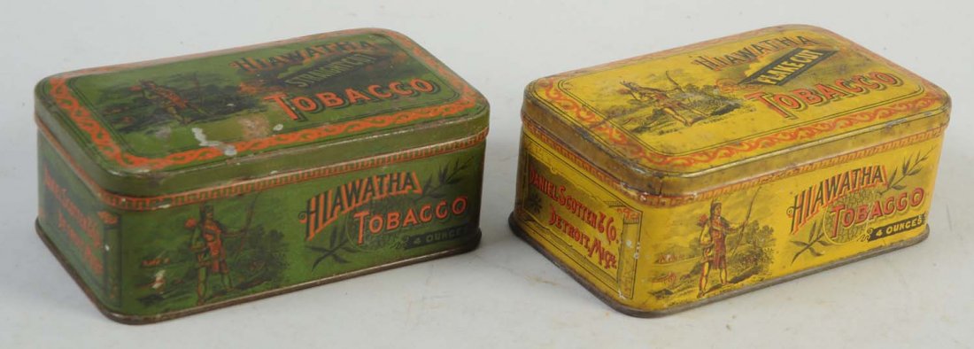 Pair of Hiawatha Tobacco Tins.: Yellow and green variations. Descent overall condition, with modest amounts of wear. Some slight oxidation to the lid of the green variation.
