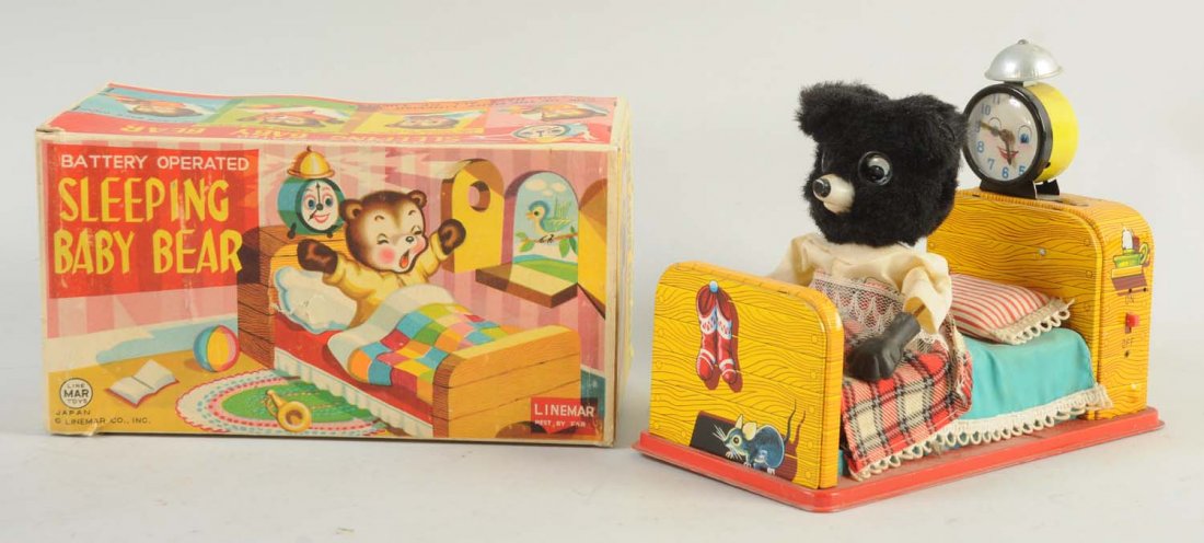 Japanese Linemar Sleeping Baby Bear Toy.: Includes box and alarm clock. Baby bear is plush with fabric clothing. Pillow, blanket and sheets are very nice and detailed. No visible scratches or dents on the tin part of the toy. Battery