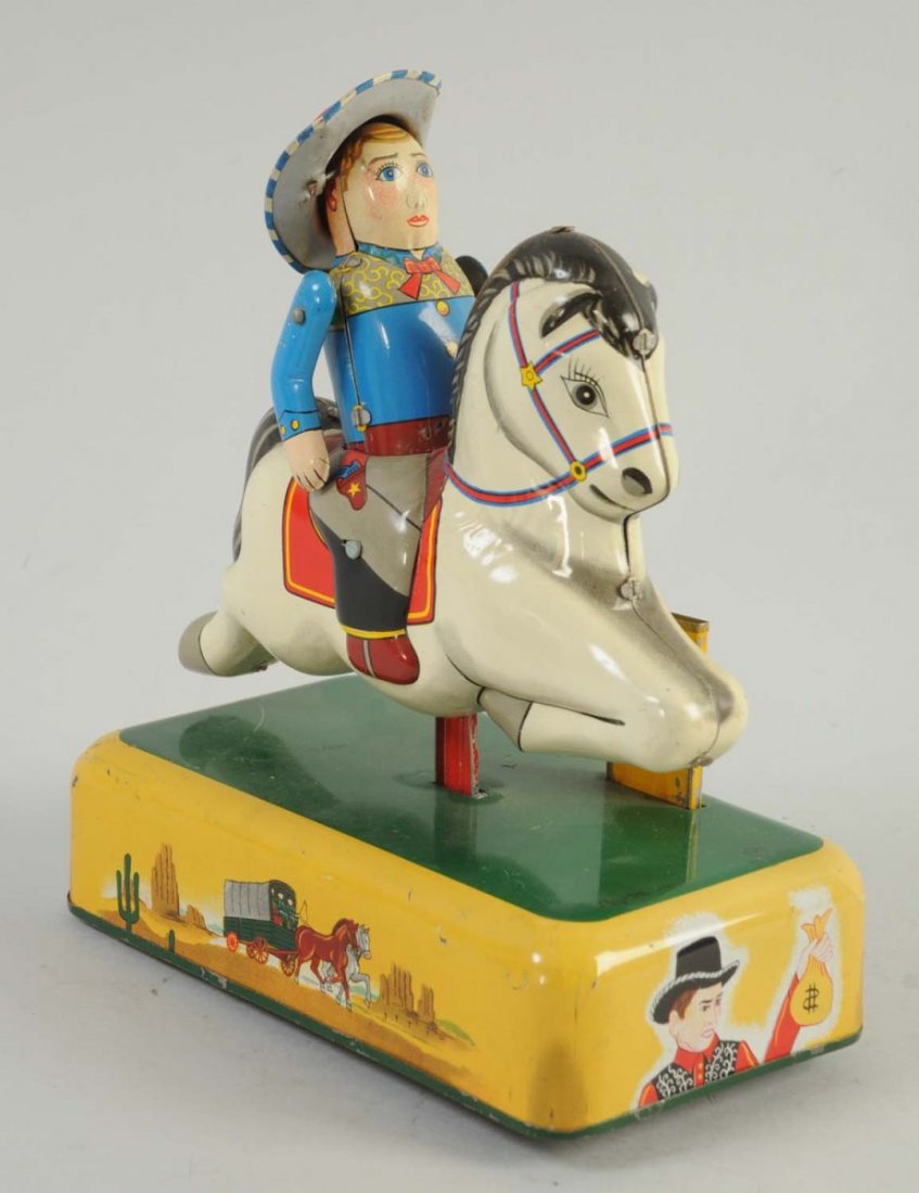 Japanese Tin Cowboy and Horse Toy.: Toy has some minor scratches towards the base. Otherwise, the colors are very beautiful. Cowboy includes his moving arms and his tin hat. Battery compartment is very clean with no scratches.