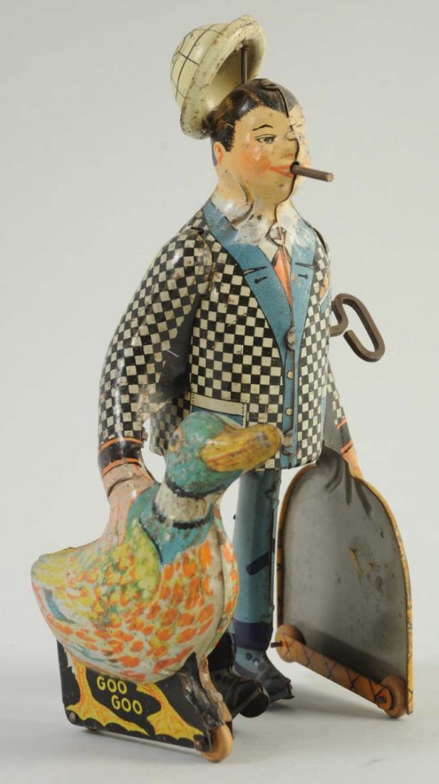 Marx Tin Wind-Up Man with Duck.: There are some little scratches and loss, mainly to the jacket of the man and the top of his tin hat. Otherwise the colors are very bright. The toy includes the tin duck, basket, hat, and