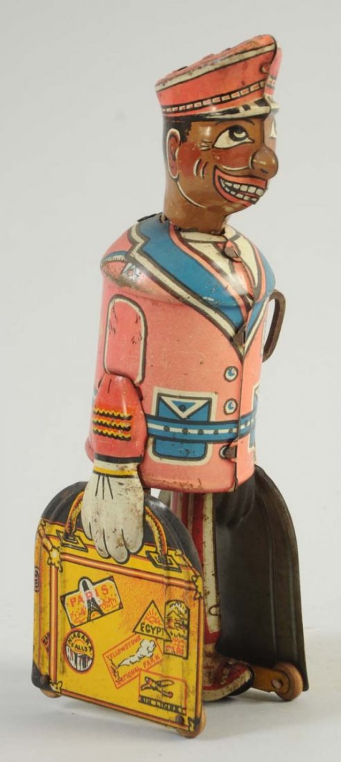 Marx Tin Wind-Up Red Cap Porter.: The suitcases have very minor litho scratches, and there is slight oxidation to the top of the porter's hat. Condition (Very Good - Excellent). Size 8 -1/2" T.