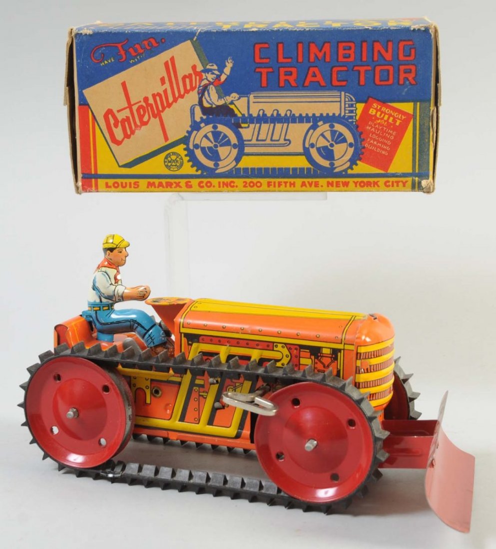 Marx Tin Litho Wind-Up Caterpillar Climbing Toy.: Includes colorful original box. Box has some staining and creasing. Tractor has original tin litho driver, and front plow. Rubber treads look to be original. Some minor to moderate wear.