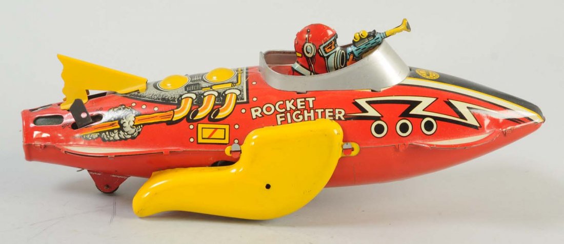 Marx Tin Wind-Up Rocket Fighter.: Toy has very minimal minor scratches on the side fins, and throughout the front of the body. Otherwise the colors are very bright and stunning. Includes tin pilot, who has a tin gun pointed