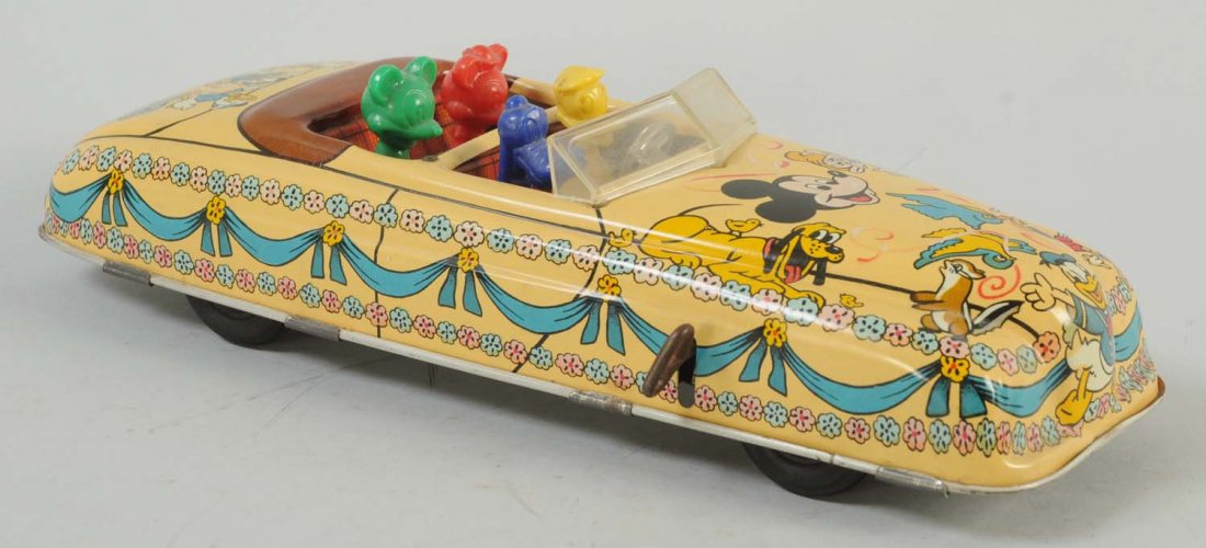 Marx Tin Litho Wind-Up Disney Car.: Car has no visible scratches or dents. Very clean with beautiful and bright colors throughout the entire car. Includes driver and three Disney character passengers.