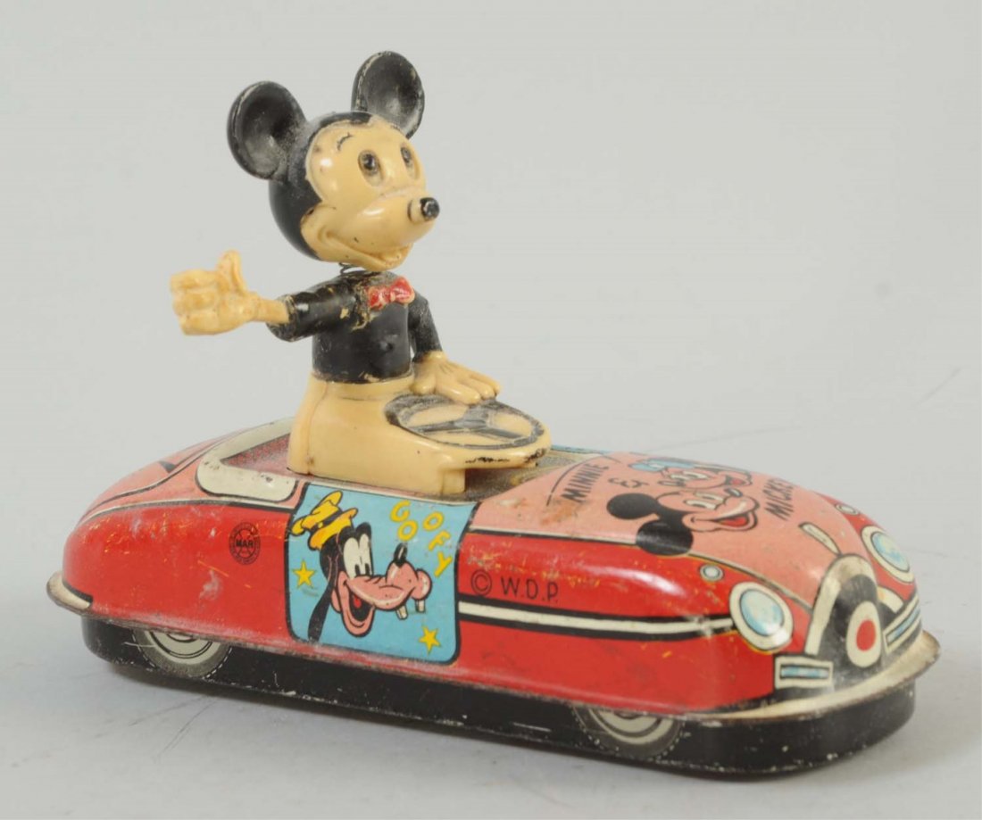 Marx Tin Litho Wind-Up Mickey Mouse Car.: Significant litho scratches throughout the entire toy, on the top and on the bottom. Mickey Mouse is the driver with a wiggling hat. Otherwise, nice colors throughout the car, with graphics of Mickey