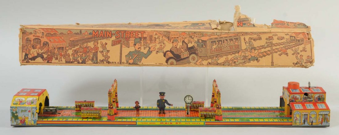 Marx Tin Wind-Up Main Street Bridge.: With the original box. The toy has no visible scratches or dents to the litho, there is only one minor scratch to the top of one of the buildings. Otherwise, the toy has beautiful and stunning
