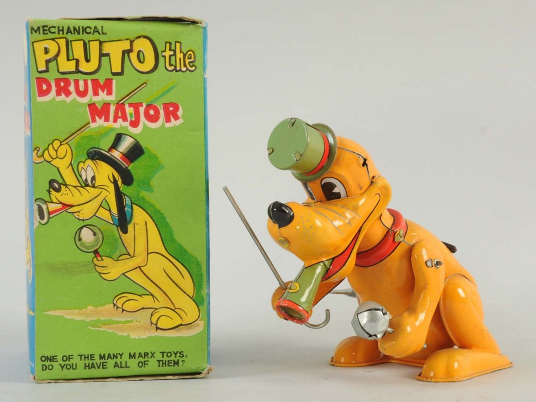 Marx Tin Wind-Up Pluto Toy.: Includes box, cane, hat and noise maker. Pluto is very bright orange in color throughout his body. Some very minor scratches throughout the toy, mainly behind his head. Otherwise, the toy is very
