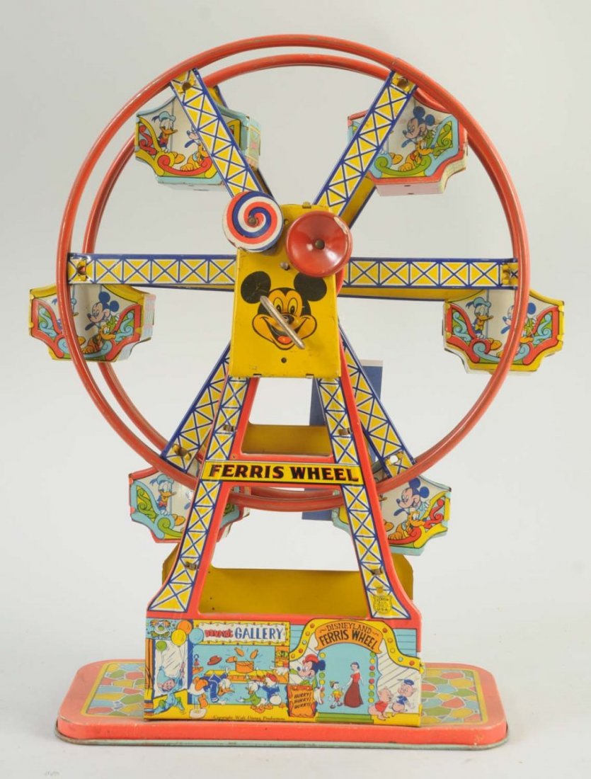 Chein Tin Wind-Up Disneyland Ferris Wheel.: There are some scratches and litho loss to some parts of the toy, mainly around parts of the ferris wheel. Some of the support columns are slightly bent, and the ferris wheel does not turn