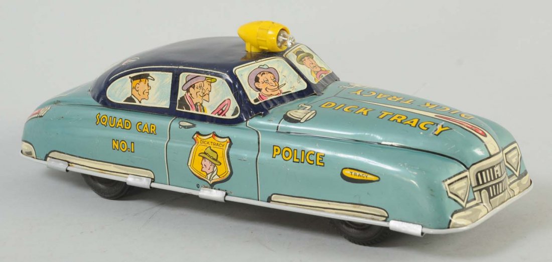 Marx Tin Litho Wind-Up Dick Tracy Car.: Friction powered with a space for a battery on the bottom to light up a light on top. Some minor scratches throughout the car, towards the top of the car and hood. Bottom of the car is very clean.