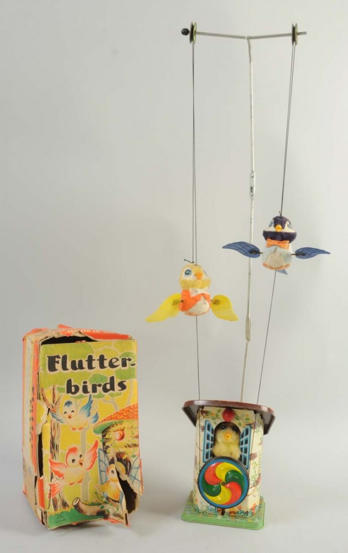 Alps Tin Battery-Operated Flutter Birds.: There are very minor scratches towards the base of the toy, but the battery compartment is very clean. The birds are plastic and plush, and are in very good condition. The toy includes its