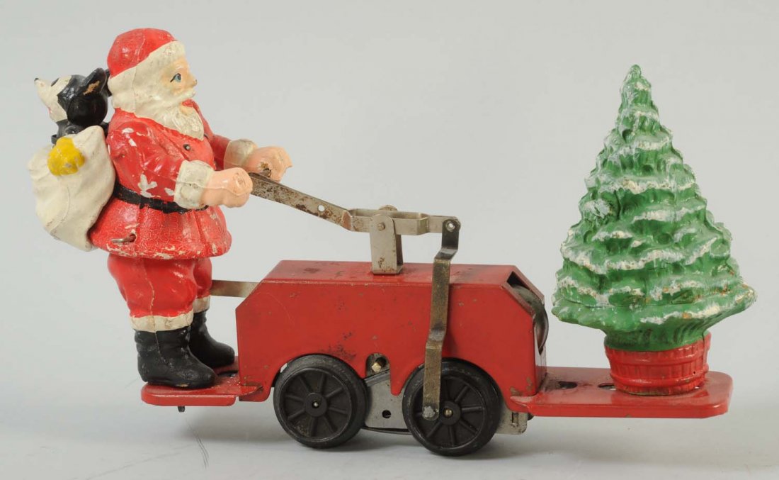 Lionel Mickey Mouse Santa Car.: The toy is tin and pressed steel, it has some scratches and paint loss to the top and bottom of the toy. Santa is driving the cart with a sack on his back with Mickey Mouse in it, and on the