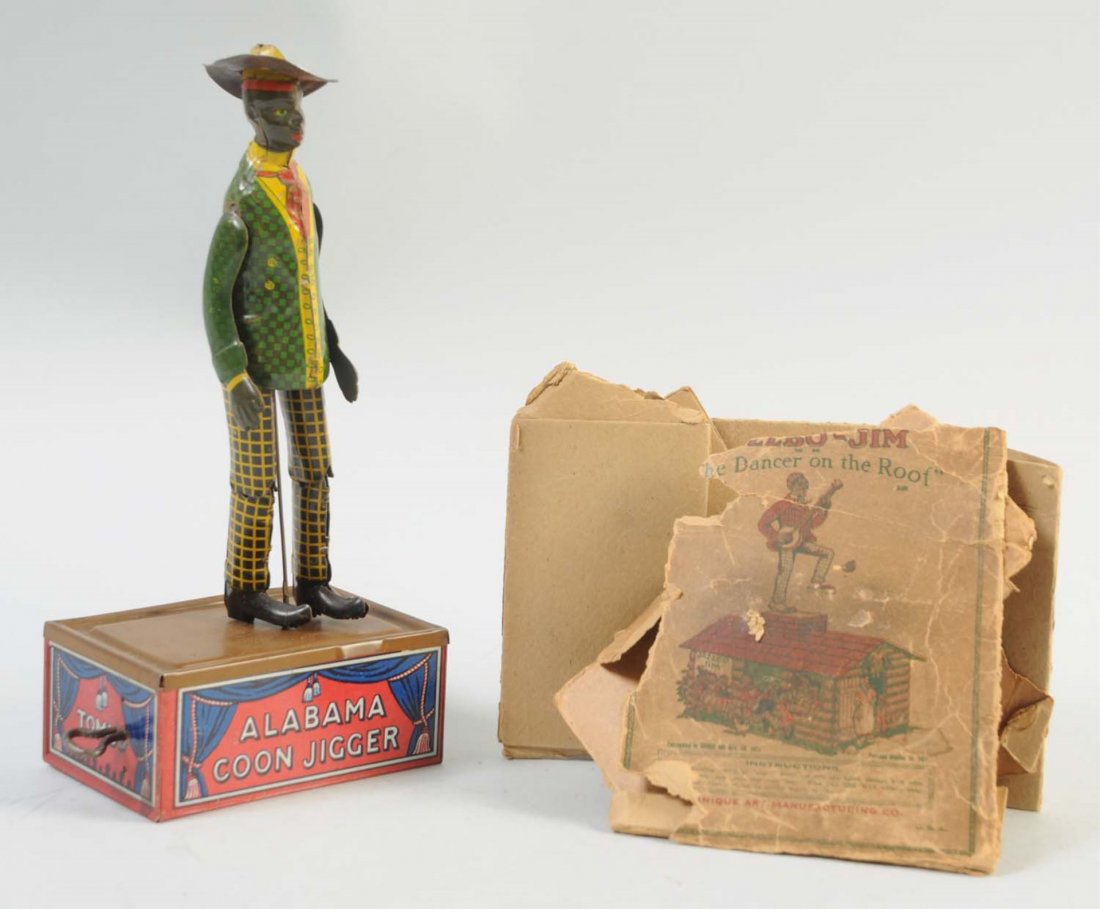 Ferdinand Strauss Tin Wind-Up Tombo Coon Jigger.: Includes the original key. Very slight scratches to the top of the platform from his tin shoes, and some scratches to the top of his arms. Otherwise the colors are very bright and beautiful. Bottom