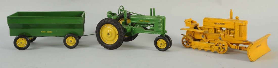 Lot of 3: Tin and Diecast Tractors and Trailers.: All John Deere. Includes cast iron plow, one tractor and one John Deere wagon with trailer. Decals are good. Some chipping and wear, especially to the yellow bulldozer.
