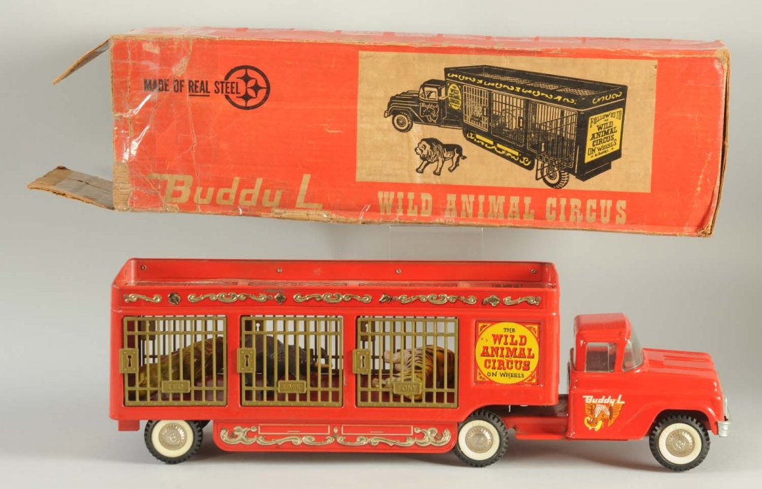Pressed Steel Buddy L Circus On Wheels Truck.: The truck has beautiful colors throughout and includes the animal compartments in the back. The included animals are a lion, tiger, and elephant. The truck has nice decals on the side of the cab