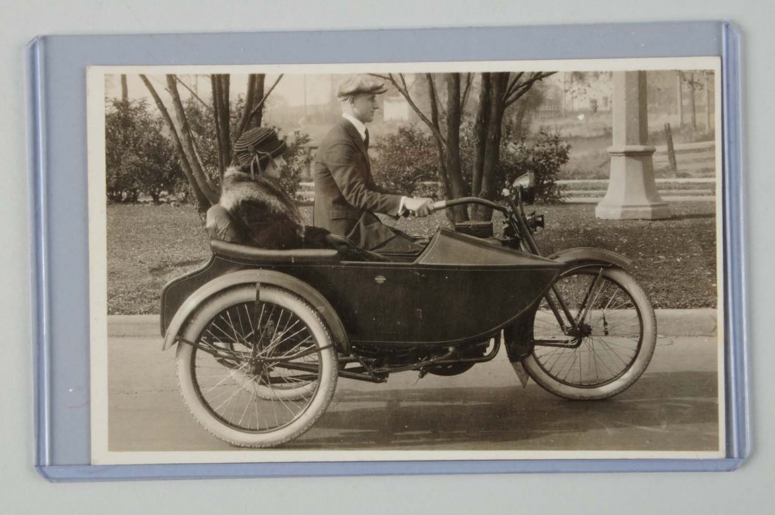 Man & Woman on Harley-Davidson RPPC.: This real photo postcard depicts a man and woman on an early Harley-Davidson motorcycle with sidecar. Condition (Excellent).