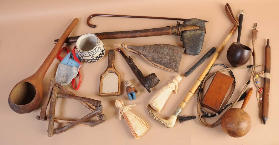 Lot of Native American Souvenir Items.: This lot includes several corn husk dolls, a small cane, a tomahawk, a rattle, and numerous other items. Condition (Very Good). Size Largest: 27" L.