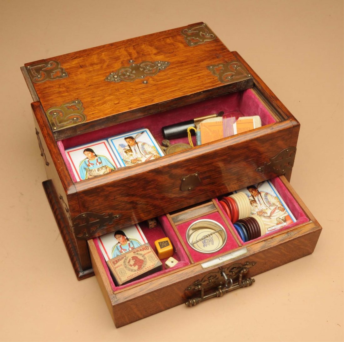 Wooden Gamblers Chest.: This early 1900s chest contains numerous items including chips, dice and a single shot pistol. Condition (Excellent). Size 12" L.CORRECTION: The pistol in this lot is antique. It is a rare single shot