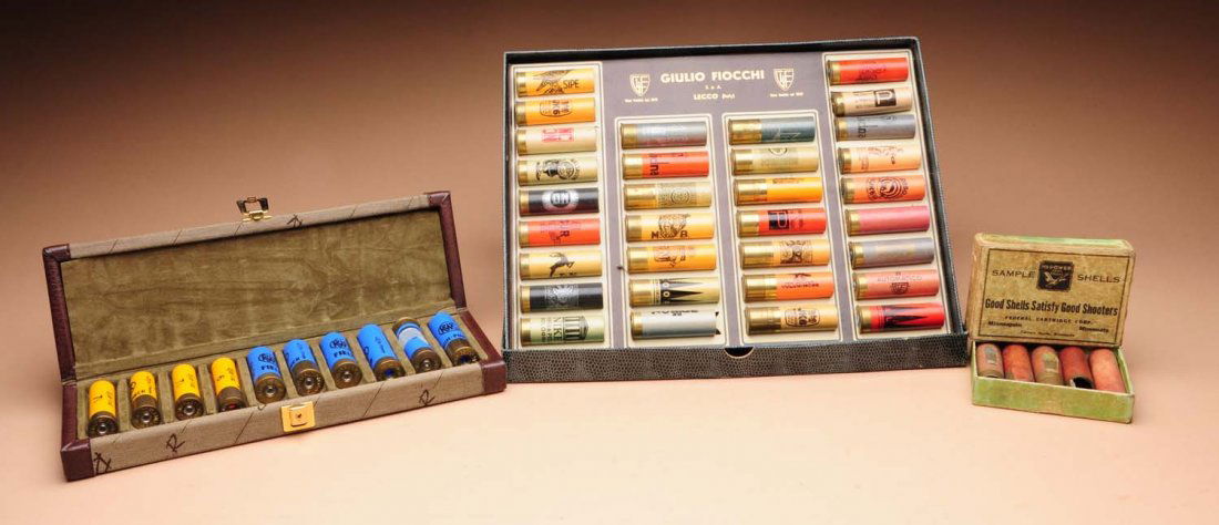 Shotgun Shell Salesman Sample Collection (3).: This collection of salesman samples in their original boxes include; a large cardboard box consisting of 32 ornate paper shot shells each with wonderful graphics in the original case, a box of RWS sal