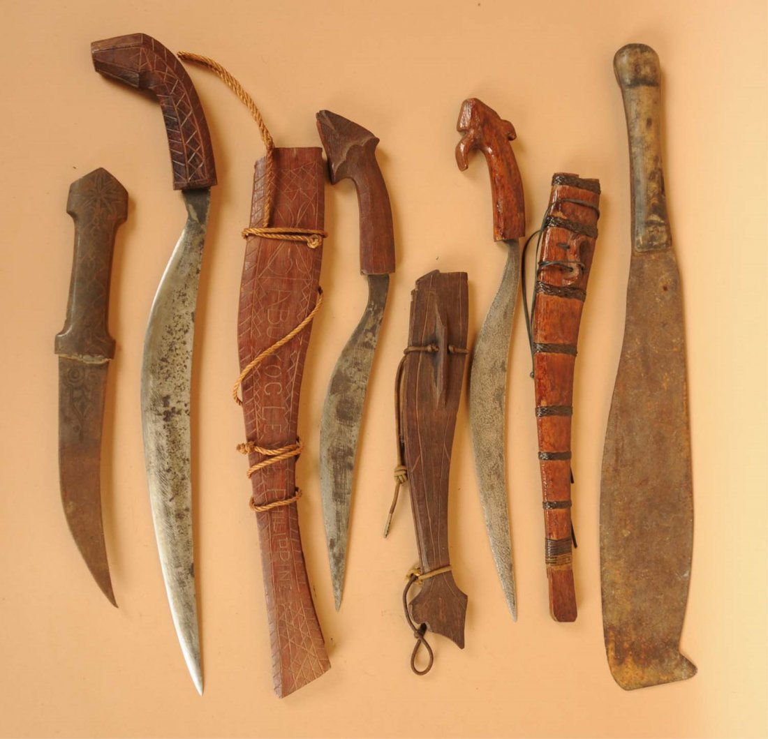 Lot of 5: Foreign Exotic Knives.: Includes a Morocco Koummya curued knife with a 6 - 1/2" blade, overall 11 - 1/2". Handle is corroded iron over a soft base material. No sheath. Second is a Philippine fixed blade knife. Blade length i